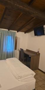 Voodi või voodid majutusasutuse Albergo Al Gambero toas