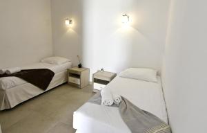 Postel nebo postele na pokoji v ubytování Gemütliches Appartement in Tar mit Garten, gemeinschaftlichem Pool und Grill + 14 fotografií