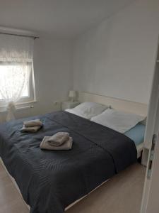 Postel nebo postele na pokoji v ubytování Apartmani Pavic
