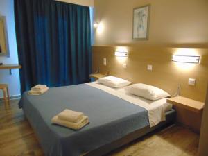 Postel nebo postele na pokoji v ubytování Polyxeni Hotel