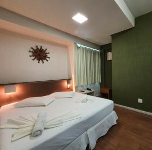 Cama ou camas em um quarto em Excellence Comfort Hotel