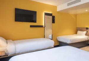 Postel nebo postele na pokoji v ubytování B&B HOTEL Orléans Saran