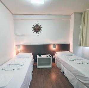 Cama ou camas em um quarto em Excellence Comfort Hotel