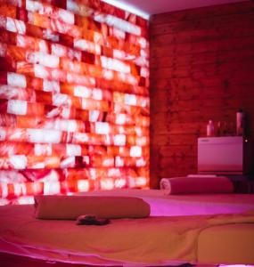 a room with a bed and a brick wall at LA TOUR AUX CRABES près de la plage in Dieppe