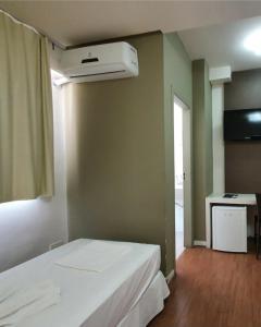 Cama ou camas em um quarto em Excellence Comfort Hotel