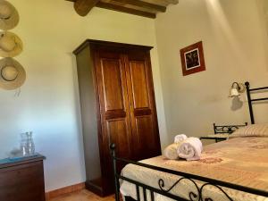 Postel nebo postele na pokoji v ubytování Agriturismo Melodie Toscane Sorano