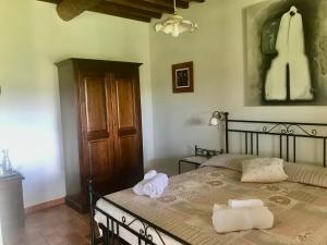 Postel nebo postele na pokoji v ubytování Agriturismo Melodie Toscane Sorano