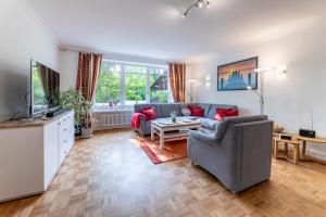 TV a/nebo společenská místnost v ubytování Villa Magnolia