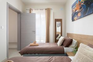 Ένα ή περισσότερα κρεβάτια σε δωμάτιο στο Edka Suites - Modern Sunlit 2BD Apartments with Balconies - Close to Sliema Promenade, St Julian's & St Georges Bay