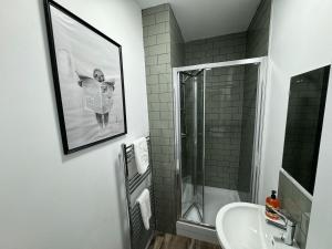 a bathroom with a shower and a sink at Staywell Hartlepool in Hartlepool