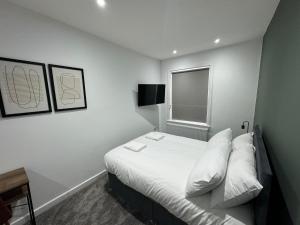 a hotel room with a bed and a window at Staywell Hartlepool in Hartlepool