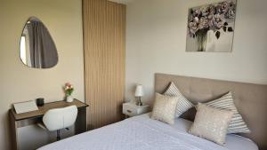 Postel nebo postele na pokoji v ubytování Elegante apartamento en Playa de Gandía + 14 fotografií