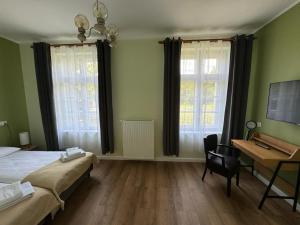 Willa Zachęta Guesthouse&Coffee客房内的一张或多张床位