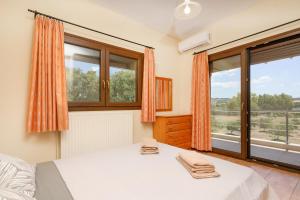 Postel nebo postele na pokoji v ubytování Tasos Apartment