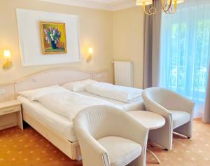 מיטה או מיטות בחדר ב-Hotel Stenitzer
