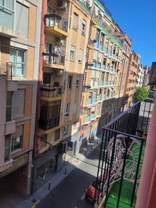 a view from an apartment balcony of a building at Gemütliches Zimmer "Gold" für 2 Personen und Katzenliebhaber in Valencia
