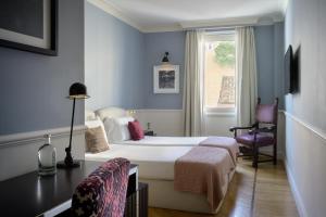 Cama ou camas em um quarto em The Fifteen Keys Hotel