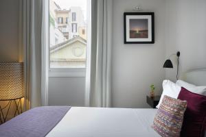Cama ou camas em um quarto em The Fifteen Keys Hotel