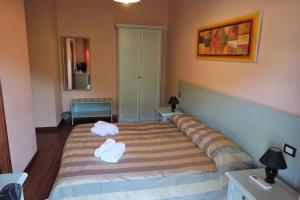 Posteľ alebo postele v izbe v ubytovaní Bosa Guest House