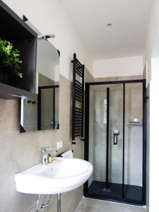 a bathroom with a sink and a shower at Your Refuge in Lecco - Lake Como in Lecco +19 photos