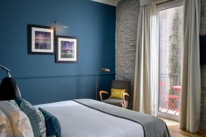 Cama ou camas em um quarto em The Fifteen Keys Hotel