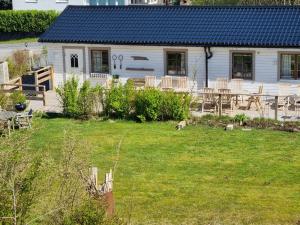 a house with a table and a cat in a yard at Haby House in Skene