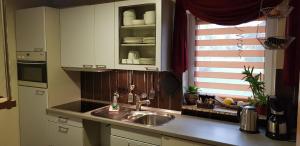 a kitchen with a sink and a window at Ferienhaus für 7 Personen ca 90 m in Marschacht, Hamburg und Umgebung in Marschacht