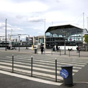 a building with a blue sign in front of it at Studio à 3 min Gare Massy-TGV in Massy
