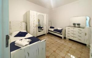 A bed or beds in a room at Stunning Home In Marina Di Lizzano