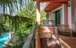 a porch of a house with a table and chairs at Holiday Home Grubine With Fireplace 10 in Grubine +37 photos