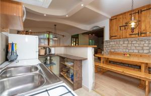 a kitchen with a sink and a counter top at Holiday Home Grubine With Fireplace 10 in Grubine