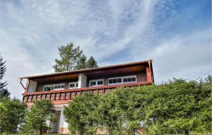 a building on top of a hill with trees at 3 Bedroom Lovely Home In Schnett in Schnett