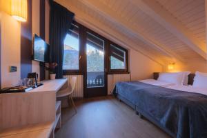 Voodi või voodid majutusasutuse Hotel Binelli toas