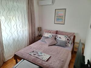 Postel nebo postele na pokoji v ubytování Apartments Anita