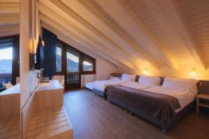 Postel nebo postele na pokoji v ubytování Hotel Binelli