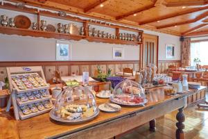 a buffet with many different types of food on a table at Hotel Alpenblick in Zeneggen