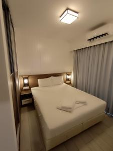 Кровать или кровати в номере Sandy Suite 2