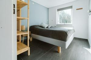 Katil atau katil-katil dalam bilik di Poldersbos 3 - Ouddorp "BarLeDunes" - met jacuzzi en sauna