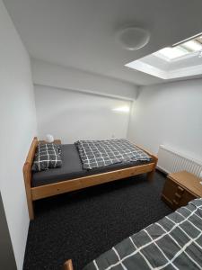 a small room with a bed in the middle of it at Zimmer in geteilter Ferienwohnung in Bremerhaven +20 photos