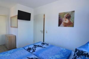 Postel nebo postele na pokoji v ubytování Ferienhaus Wotan bis 12 Personen