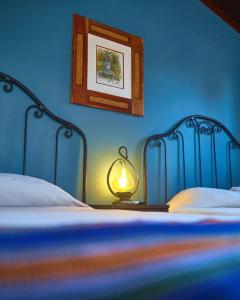 Ліжко або ліжка в номері Hotel Plaza Yat Balam