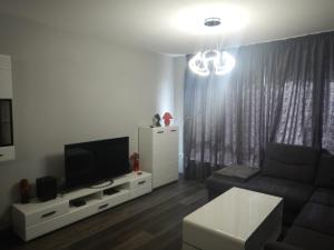 TV a/nebo společenská místnost v ubytování Sunshine terrace