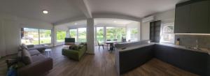 a living room with a kitchen and a dining room at Meem in Konjic