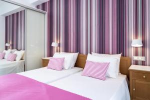 Letto o letti in una camera di Santellini Hotel