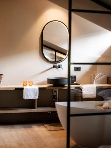 A bed or beds in a room at Sportony Mountain Lodges