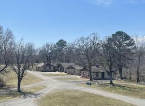 an empty road in front of a house at Stony Point Gated Resort in Jay