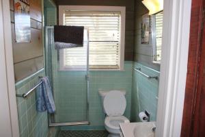 a bathroom with a toilet and a sink at Stony Point Gated Resort in Jay +44 photos