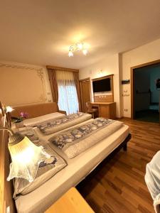 Postel nebo postele na pokoji v ubytování Hotel Franco