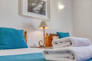 Postel nebo postele na pokoji v ubytování Ta Frenc Apartments
