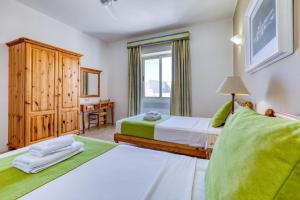 Postel nebo postele na pokoji v ubytování Ta Frenc Apartments
